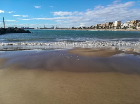 Beach of fine brown sand bathed by the waters of the Mediterranean Sea