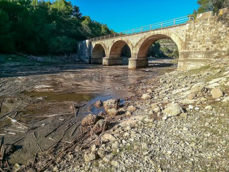 Stone bridge with three arches in the Regajo reservoir