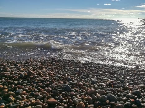Small stone beach bathed by the waters of the Mediterranean Sea