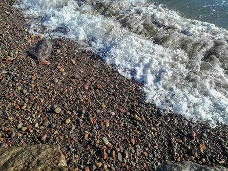 Small stone beach bathed by the waters of the Mediterranean Sea