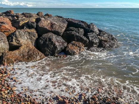 Small stone beach bathed by the waters of the Mediterranean Sea
