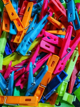 Colorful clothespins with dew water