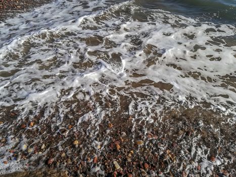 Small stone beach bathed by the waters of the Mediterranean Sea