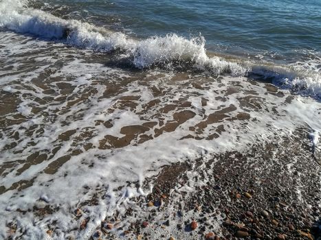 Small stone beach bathed by the waters of the Mediterranean Sea
