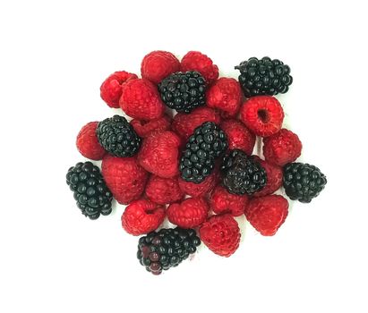 blackberries and raspberries in composition on white background