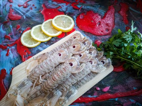 Seafood in composition on colorful and rough background