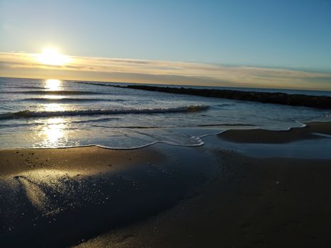 Beach of fine brown sand bathed by the waters of the Mediterranean Sea