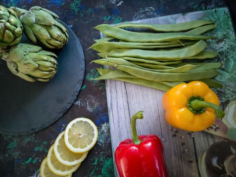 Orchard vegetables in composition on dark and rough background