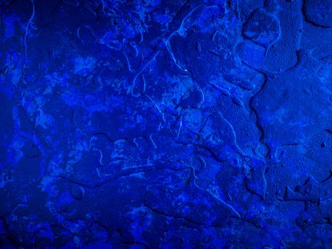 Background in purple tones with reliefs and rough texture