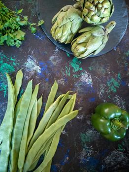 Orchard vegetables in composition on dark and rough background