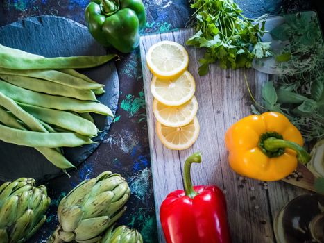 Orchard vegetables in composition on dark and rough background