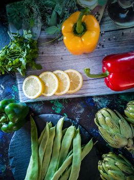 Orchard vegetables in composition on dark and rough background
