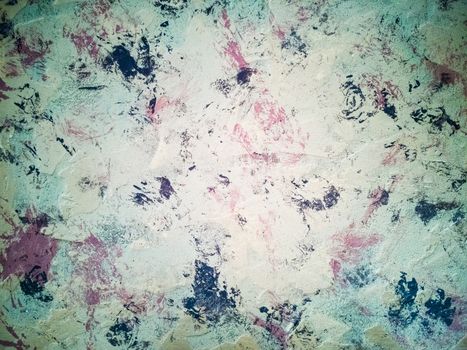 Beige background with spots in purple tones with rough texture