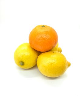 Orange and lemons in composition on white background