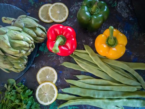Orchard vegetables in composition on dark and rough background