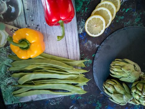 Orchard vegetables in composition on dark and rough background