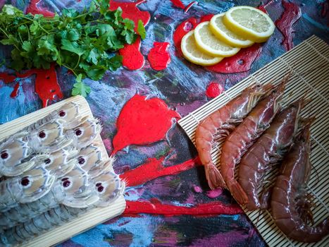 Seafood in composition on colorful and rough background