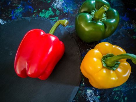 Orchard vegetables in composition on dark and rough background