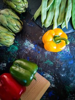 Orchard vegetables in composition on dark and rough background