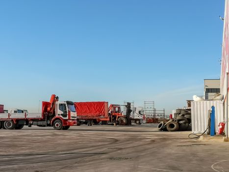 Truck parking with tires stacked in a factory