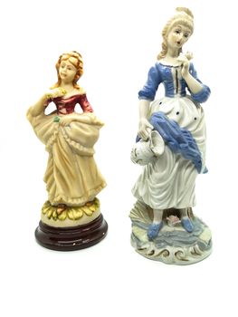 Ceramic figures of people on white background