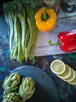 Orchard vegetables in composition on dark and rough background