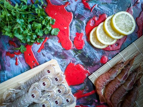 Seafood in composition on colorful and rough background