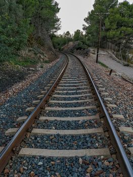 Train track through the mountain with a curve