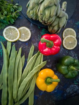 Orchard vegetables in composition on dark and rough background