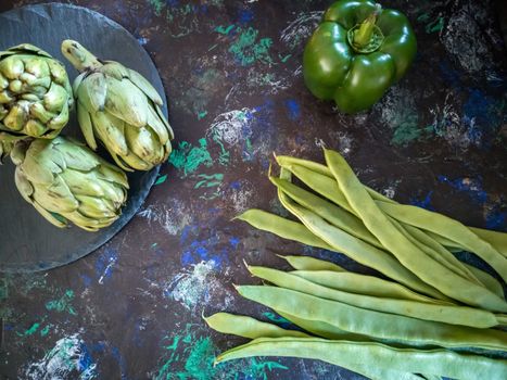 Orchard vegetables in composition on dark and rough background