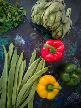 Orchard vegetables in composition on dark and rough background