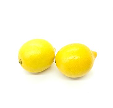 Two lemons in composition on white background