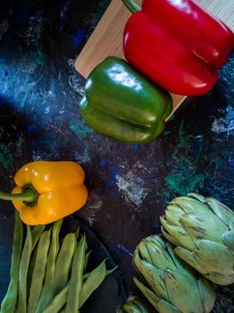 Orchard vegetables in composition on dark and rough background