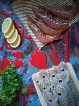 Seafood in composition on colorful and rough background