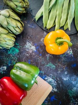 Orchard vegetables in composition on dark and rough background