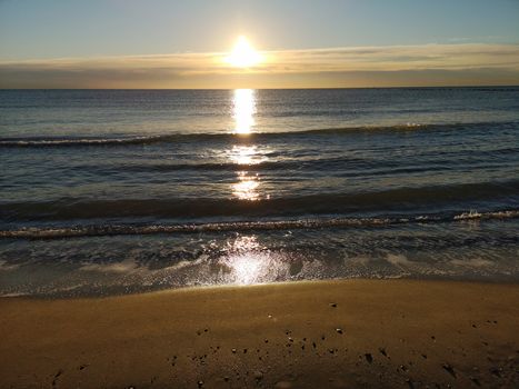 Beach of fine brown sand bathed by the waters of the Mediterranean Sea