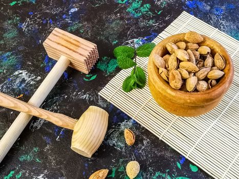 Walnuts and hazelnuts in composition on dark and rough background