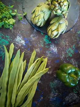 Orchard vegetables in composition on dark and rough background