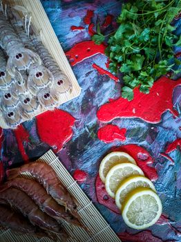 Seafood in composition on colorful and rough background