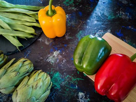 Orchard vegetables in composition on dark and rough background