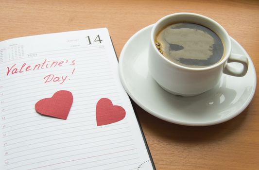 The concept of celebrating Valentine's Day, Cup of coffee, diaries, hearts