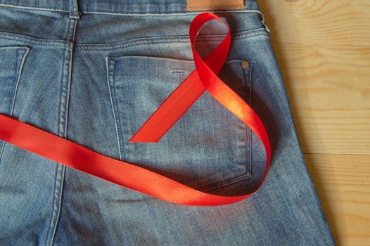 Red ribbon on the Genie is a symbol of struggle and awareness AIDS.