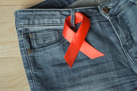 Red ribbon on the Genie is a symbol of struggle and awareness AIDS.