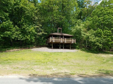 picnic shelter structure or building on stilts on grass hill