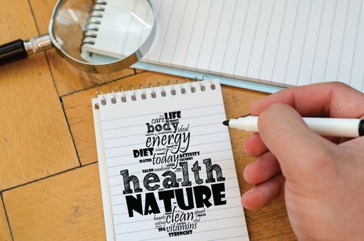 Health word cloud collage over notepad background
