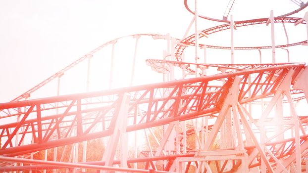 A Colorful Looping Roller Coaster On A Beautiful Sunny Day