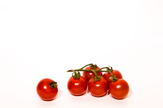 cherry tomatoes cluster with white background