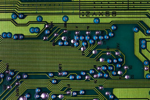 Macro picture of red printed circuit board with chips