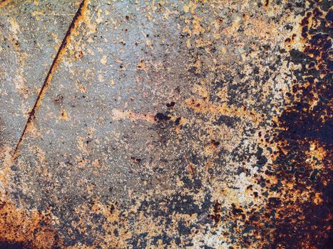 Rusty metal background with rough texture in brown tones