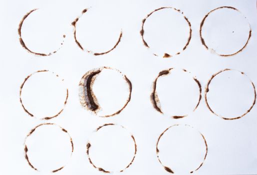 Coffee stains on white background. multiple shapes